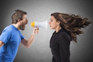 Fear mongering, man shouting to a woman